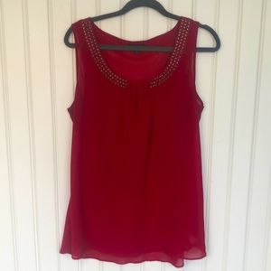 Red blouse with brass neckline detail